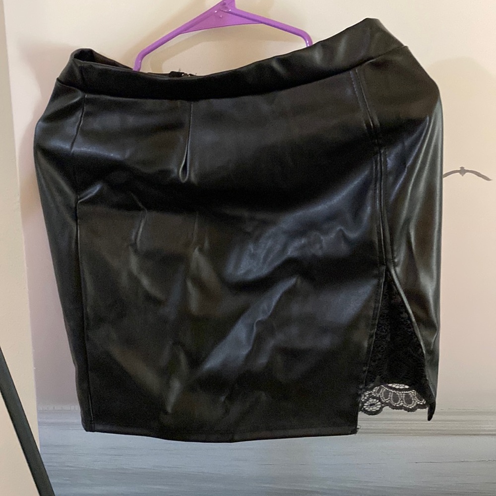 Fake leather skirt with lace accent.